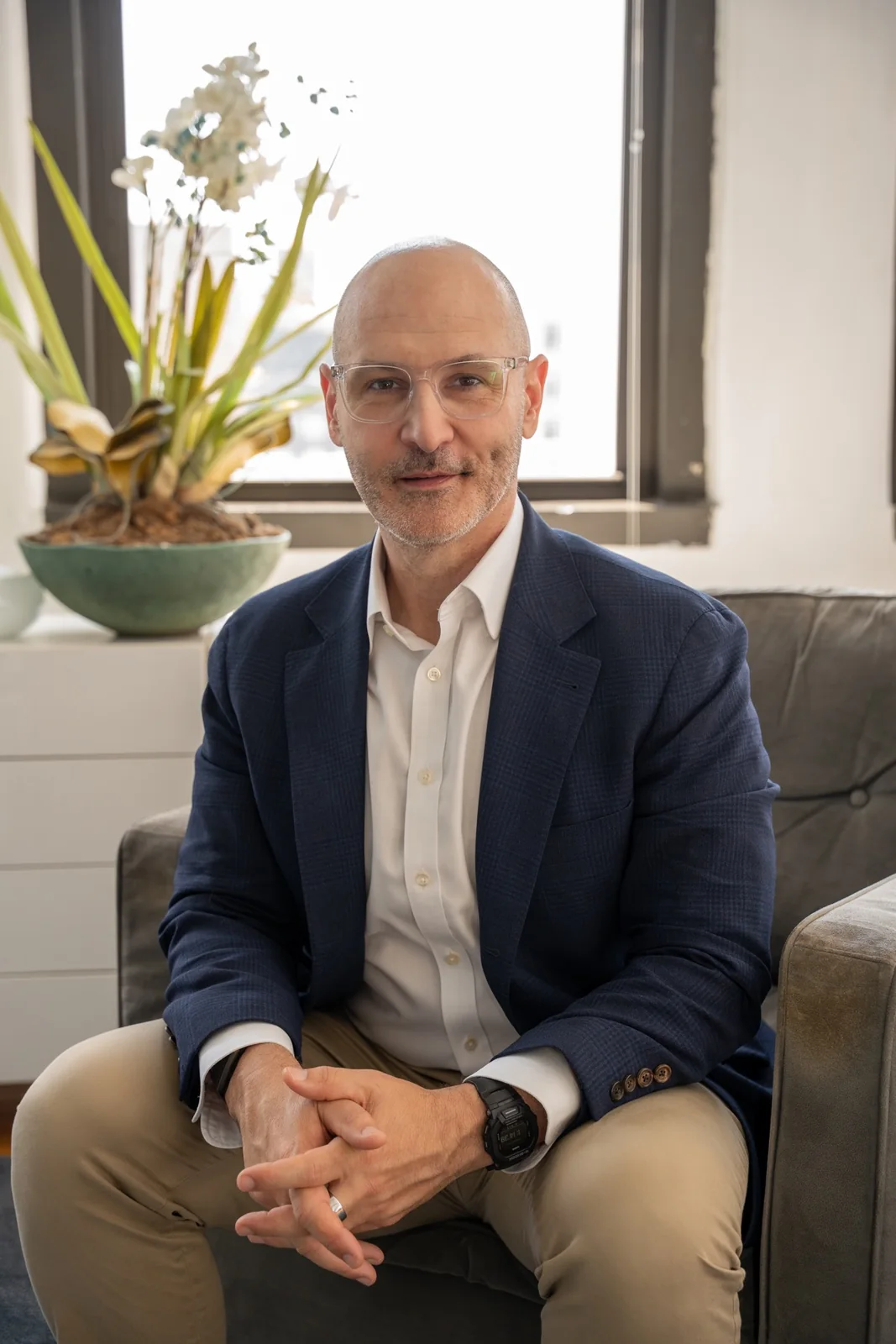 Portrait of Adam Wright seated in his consulting office