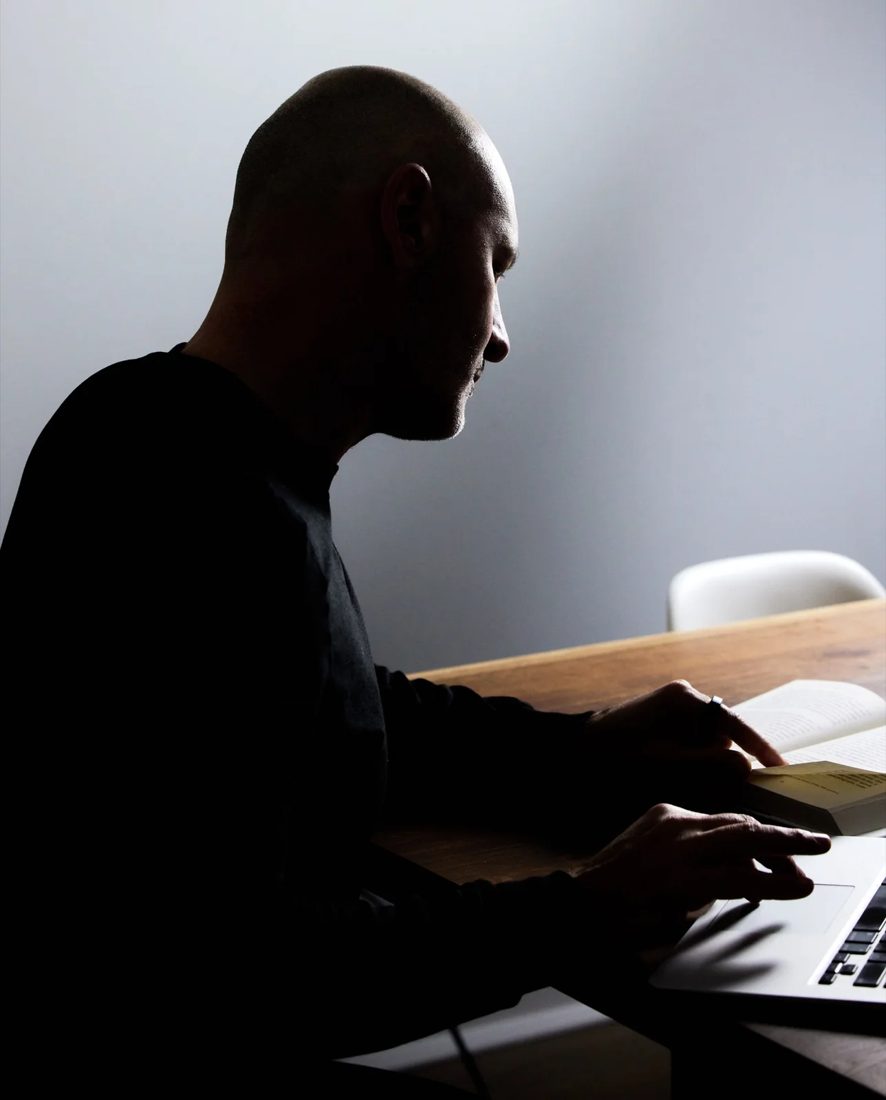 Adam Wright reviewing notes at a work table
